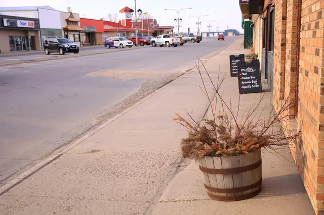 Main Street sidewalk with barrel planter