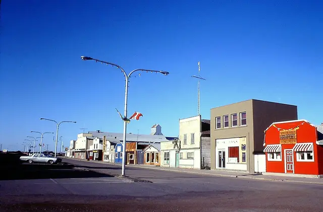 Main Street with storefronts and street lamps