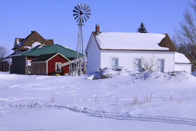 Museum buildings and windmill in winter